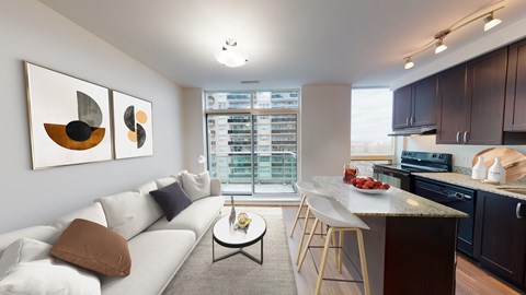A modern living room with a white couch and a coffee table.